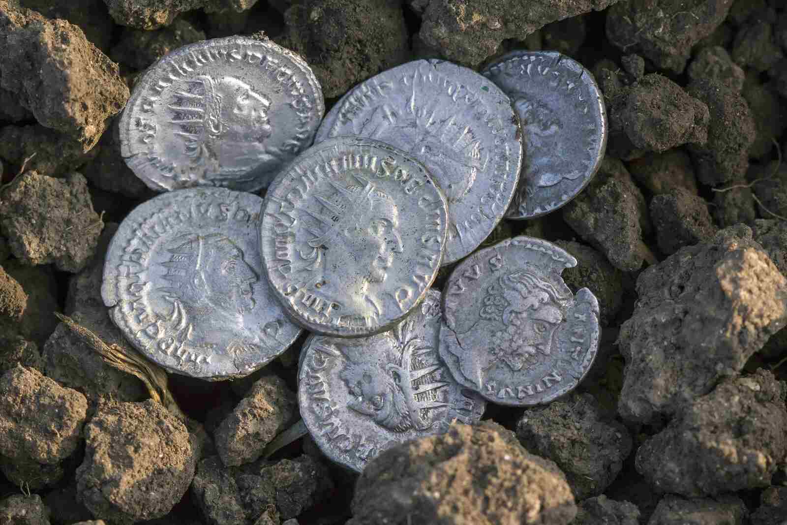 roman-silver-coins-covered-in-dirt